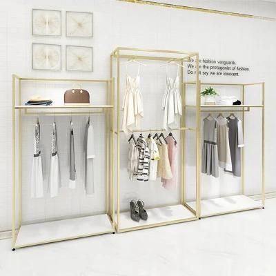 Custom Boutique Gold Clothing Wall Mounted Rack Nesting Table Clothes Shelving Garment Display